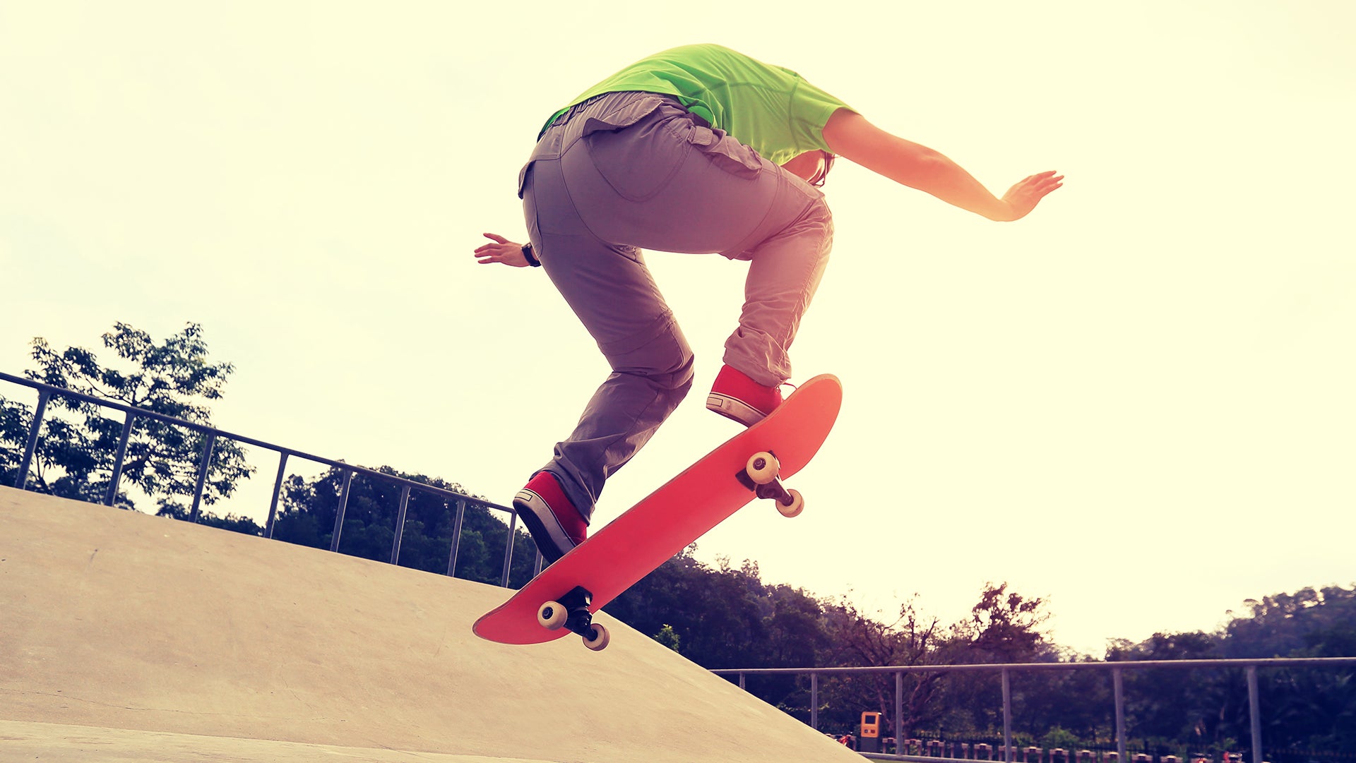 Skating in park area with amazing stunt